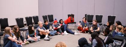 Group sitting in a circle on the floor