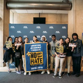 Students signing with no place for hate sign