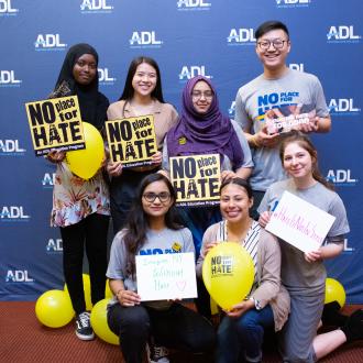 Students in front of no place for hate banner