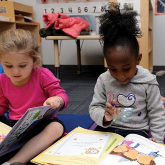 Preschoolers reading books