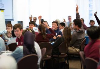 Students raising hands