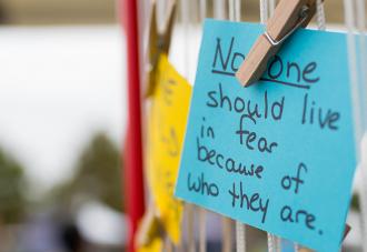 Post-it note that says: No one should live in fear because of who they are.